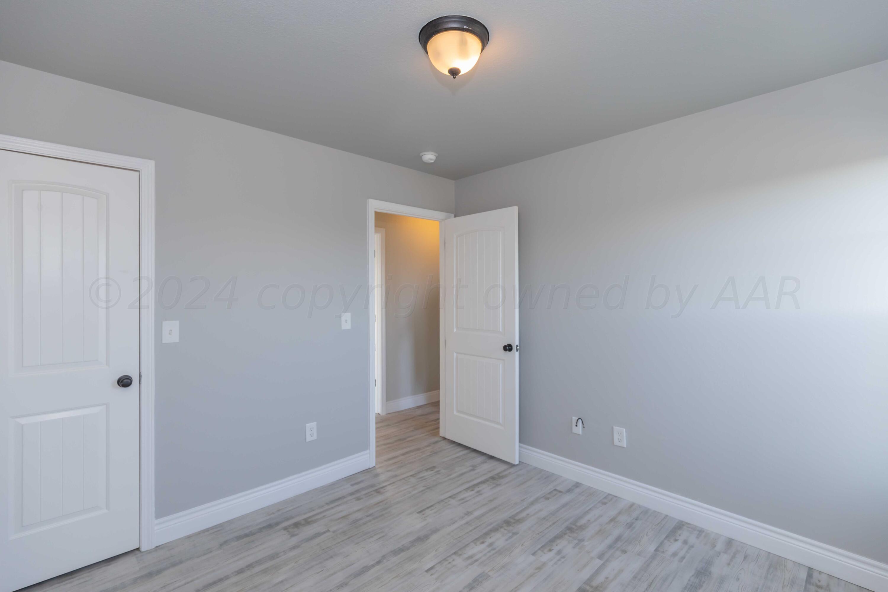 2805 Ries Lane Amarillo, TX 79118 - Photo 28 of 38 a view of room with wooden floor