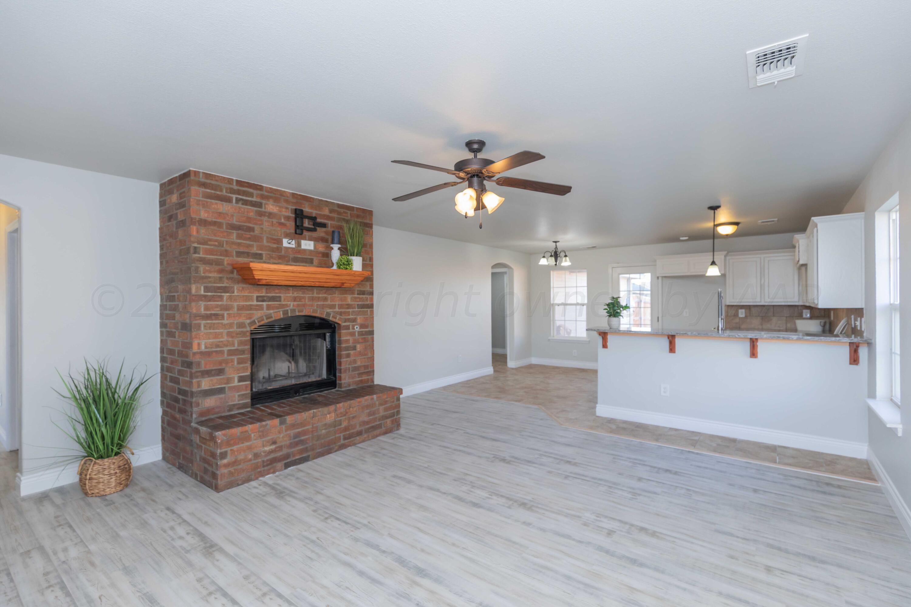 2805 Ries Lane Amarillo, TX 79118 - Photo 3 of 38 a living room with furniture and a fireplace