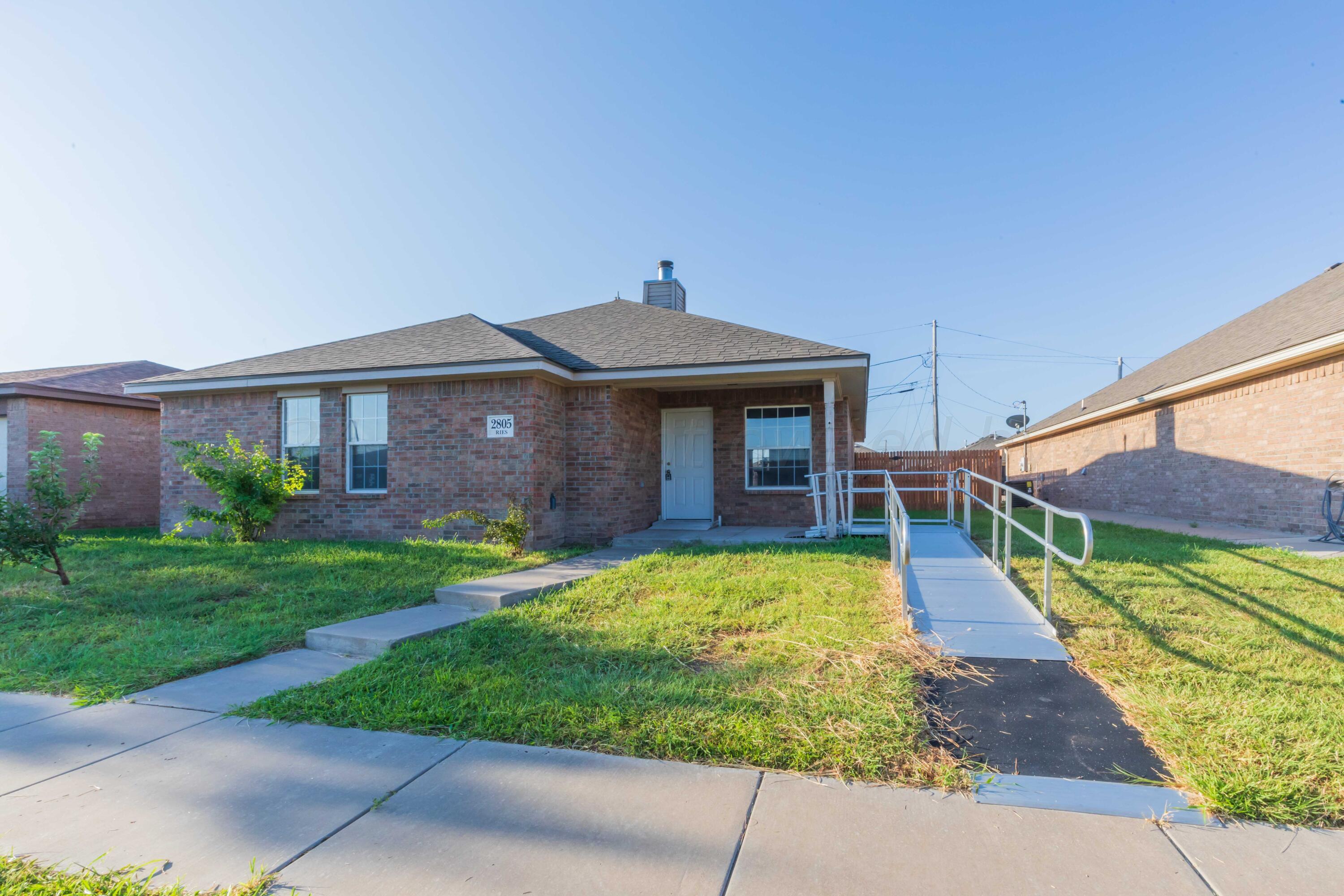 2805 Ries Lane Amarillo, TX 79118 - Photo 38 of 38 a brick house with a yard