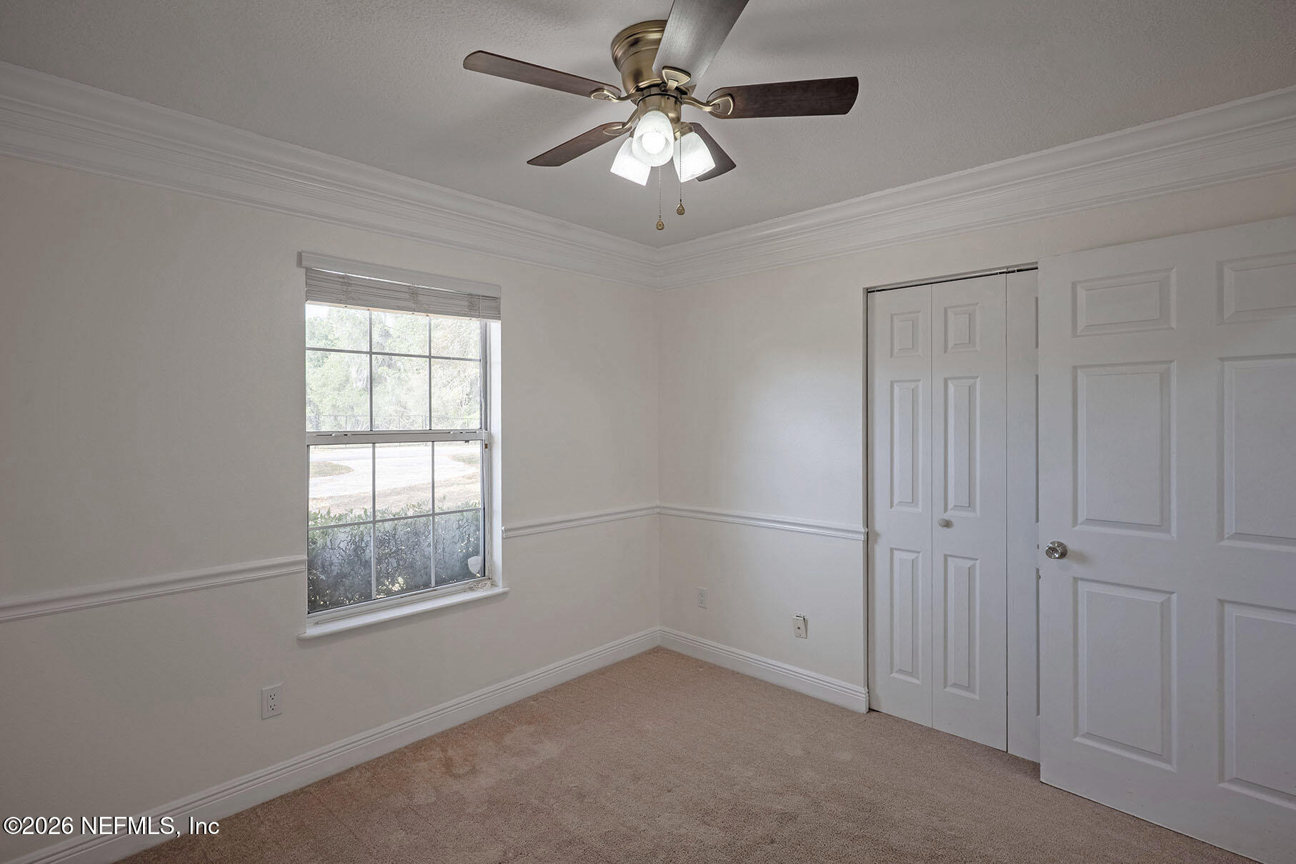 430 Southwest Jasmine Avenue Keystone Heights, FL 32656 - Photo 19 of 35 an empty room with windows and fan