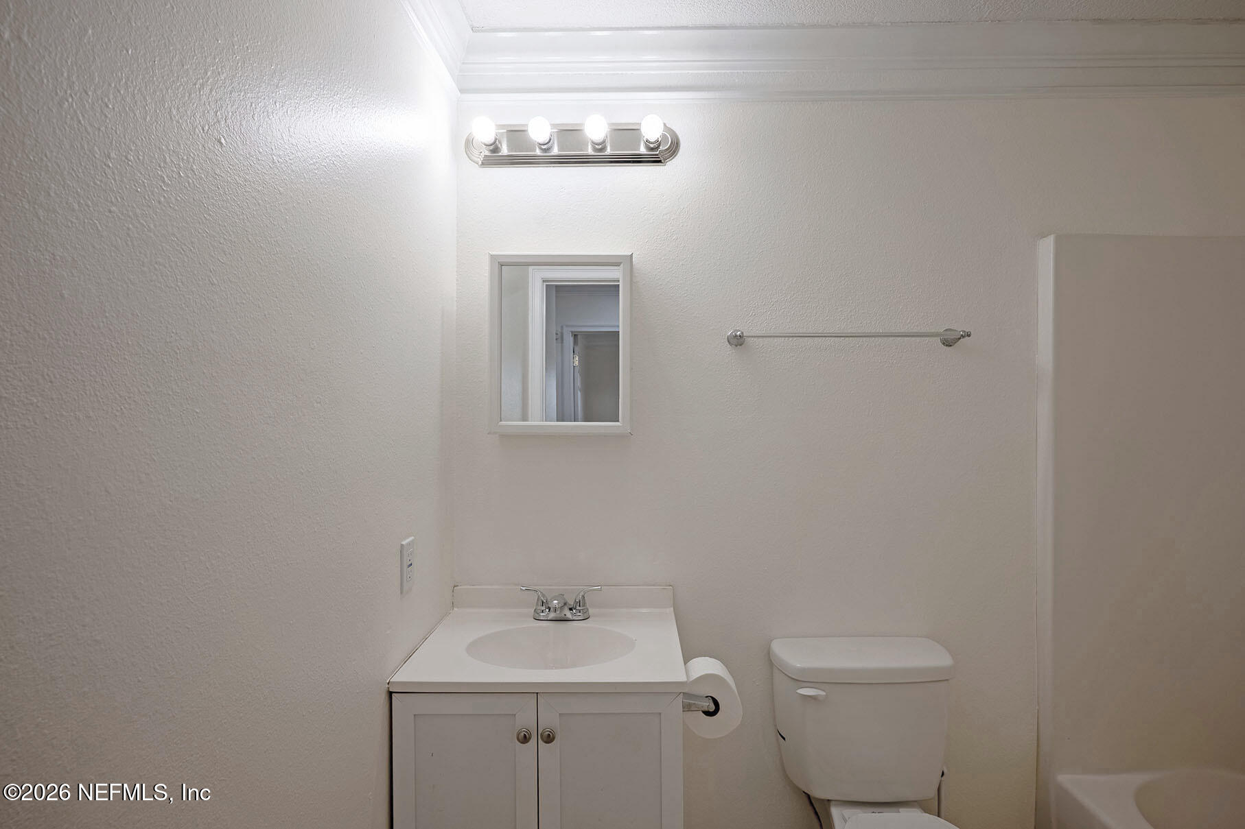 430 Southwest Jasmine Avenue Keystone Heights, FL 32656 - Photo 31 of 35 a bathroom with a toilet a sink and mirror