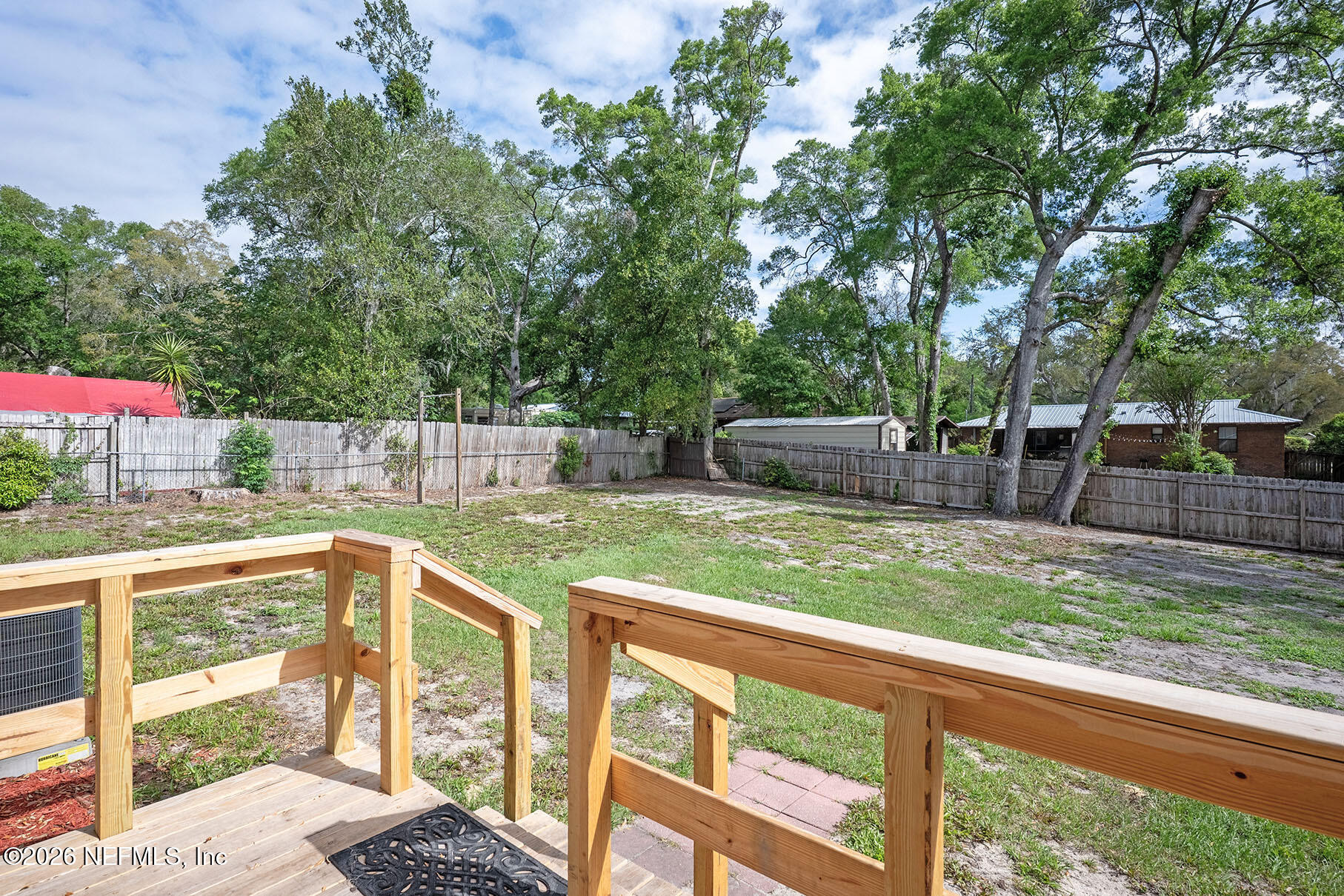 430 Southwest Jasmine Avenue Keystone Heights, FL 32656 - Photo 33 of 35 a view of a backyard and a garden