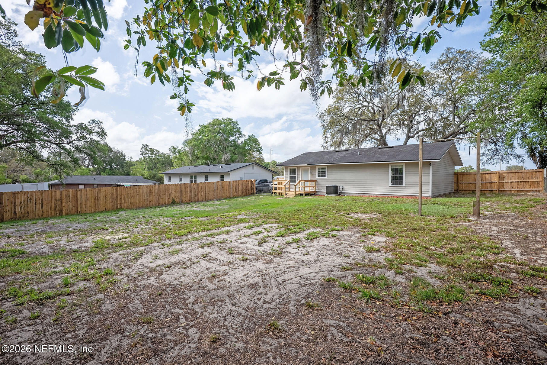 430 Southwest Jasmine Avenue Keystone Heights, FL 32656 - Photo 34 of 35 a view of a house with yard and a tree