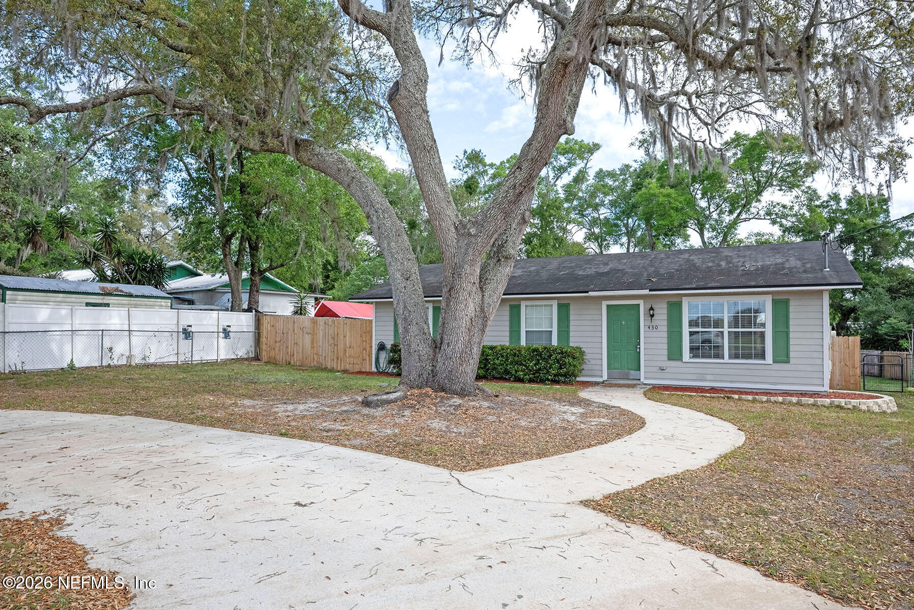 430 Southwest Jasmine Avenue Keystone Heights, FL 32656 - Photo 35 of 35 a front view of a house with a yard and trees