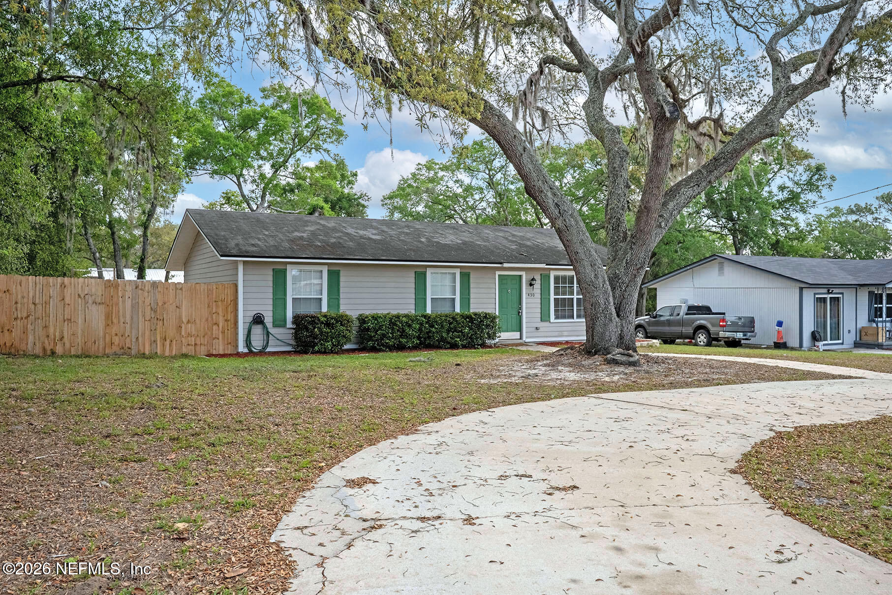 430 Southwest Jasmine Avenue Keystone Heights, FL 32656 - Photo 4 of 35 a front view of a house with a yard and trees