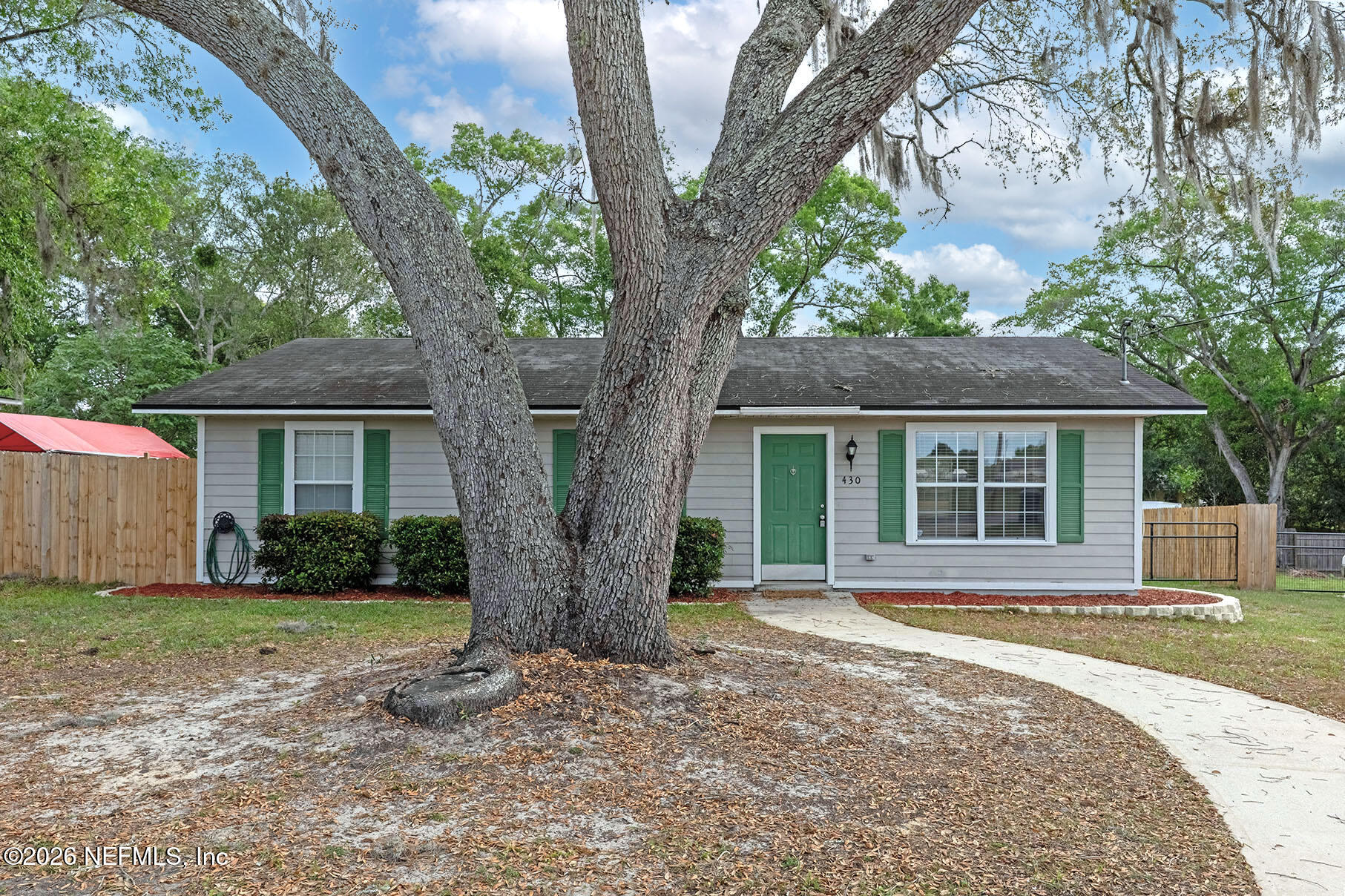 430 Southwest Jasmine Avenue Keystone Heights, FL 32656 - Photo 5 of 35 a front view of a house with a yard and an outdoor space