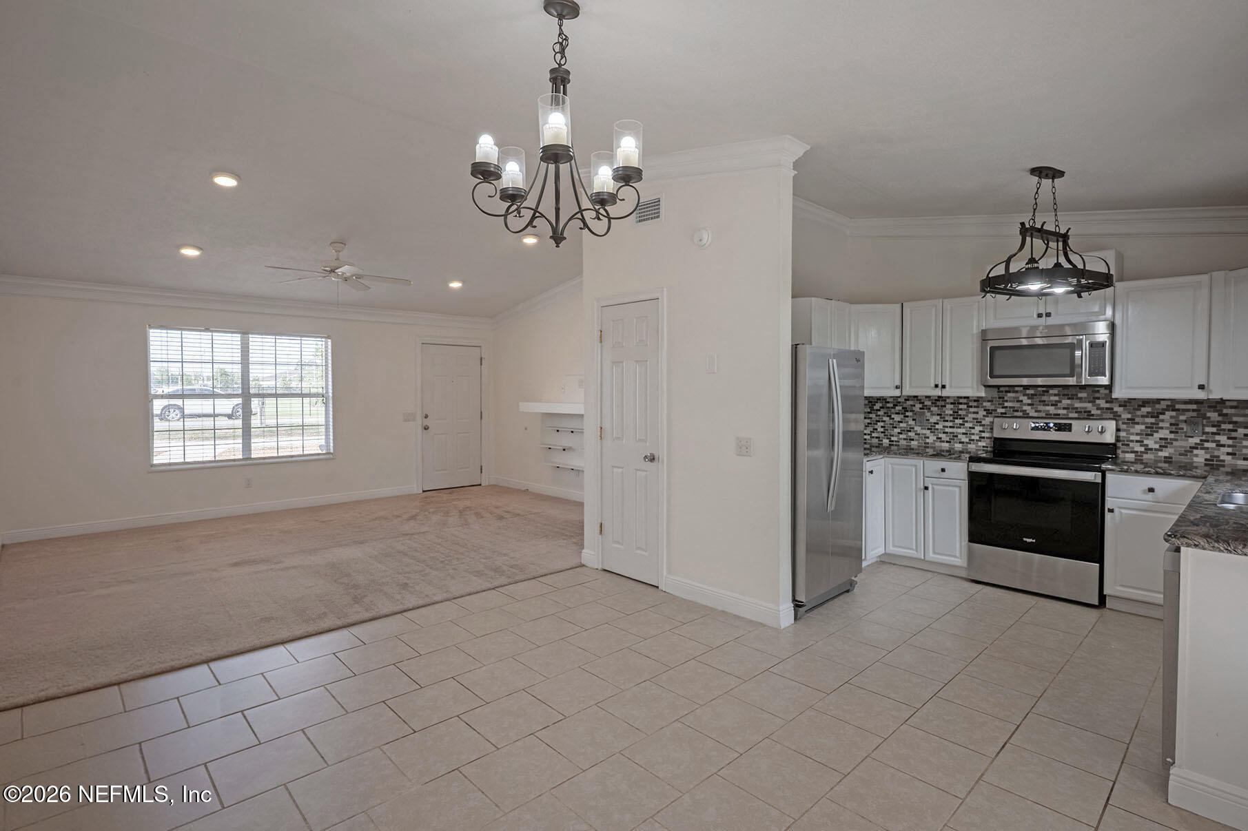 430 Southwest Jasmine Avenue Keystone Heights, FL 32656 - Photo 9 of 35 a view of a kitchen with a sink and dishwasher a stove top oven with wooden floor