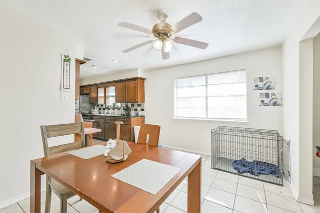 a view of a dining room with furniture window and outside view