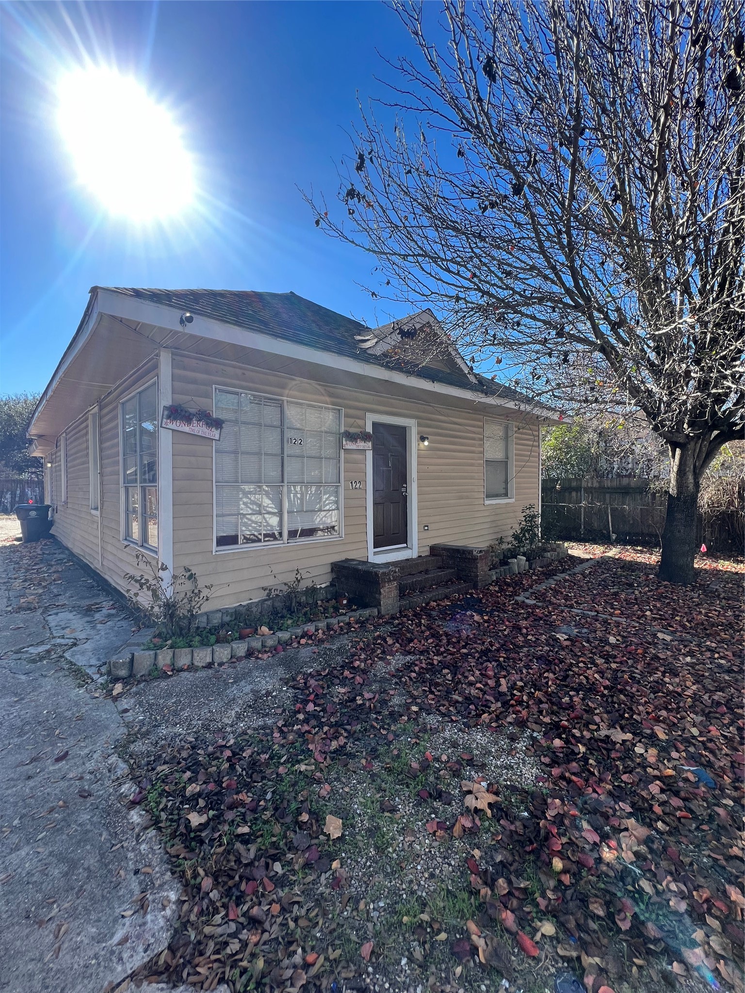 122 Redan Street Houston, TX 77009 - Photo 1 of 5 a view of a house with a yard and tree