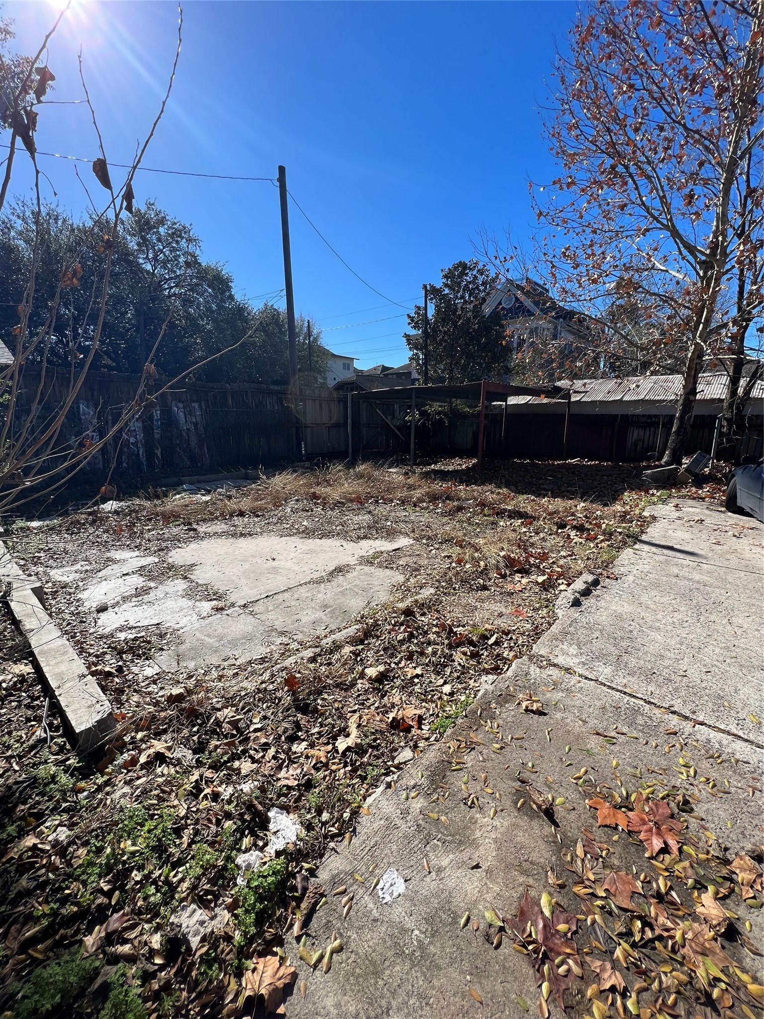 122 Redan Street Houston, TX 77009 - Photo 4 of 5 a view of a yard with wooden fence
