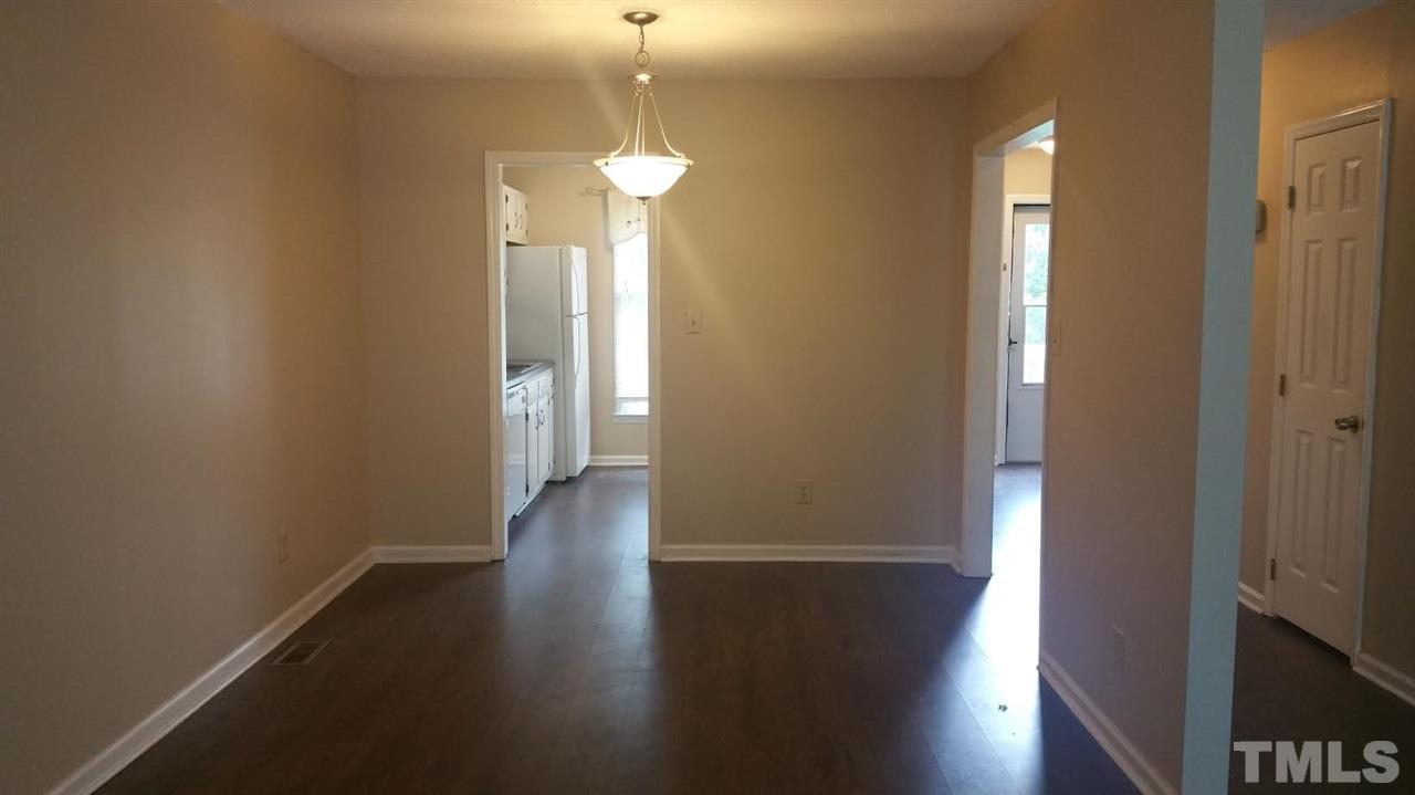 6430 English Oaks Drive Raleigh, NC 27615 - Photo 4 of 11 a view of a hallway with wooden floor