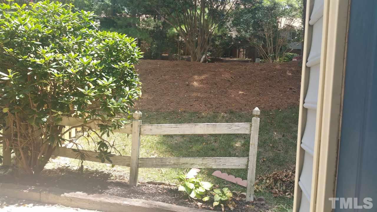 6430 English Oaks Drive Raleigh, NC 27615 - Photo 7 of 11 a view of a yard with a tree