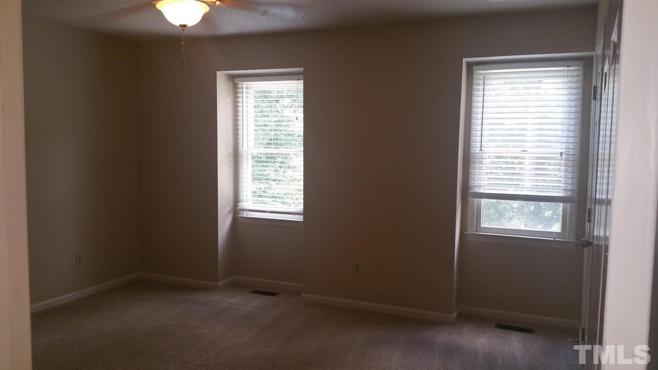 6430 English Oaks Drive Raleigh, NC 27615 - Photo 8 of 11 an empty room with a window