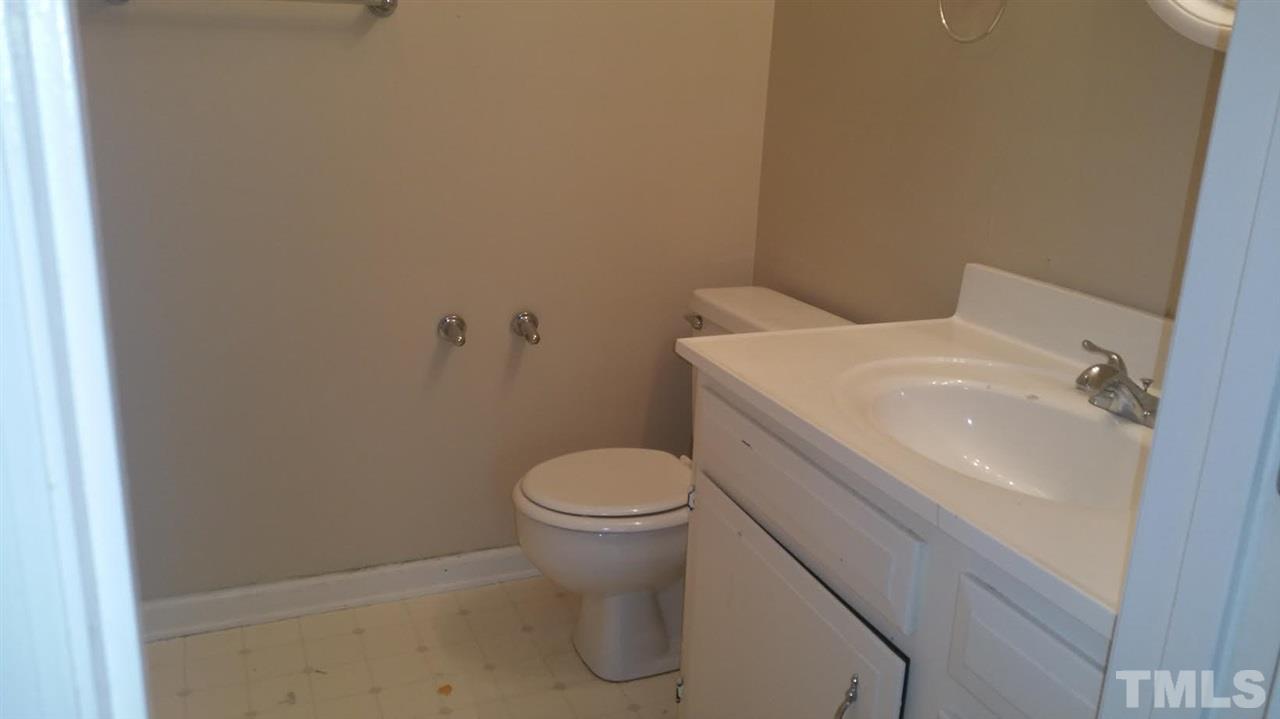 6430 English Oaks Drive Raleigh, NC 27615 - Photo 9 of 11 a white toilet sitting next to a white sink