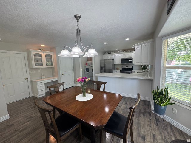 1976 River Bottom Road Springville, UT 84663 - Photo 16 of 45 Open concept dining area featuring wood-finish flooring and a brushed nickel chandelier
