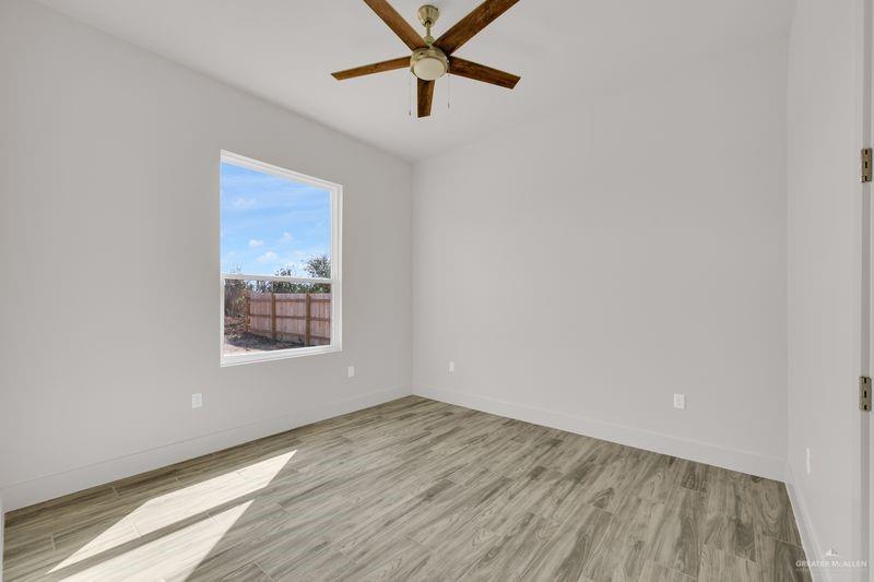 2305 Trinity Avenue McAllen, TX 78504 - Photo 11 of 24 a view of a big room with wooden floor and windows
