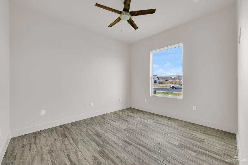 2305 Trinity Avenue McAllen, TX 78504 - Photo 13 of 24 a view of a room with wooden floor and window