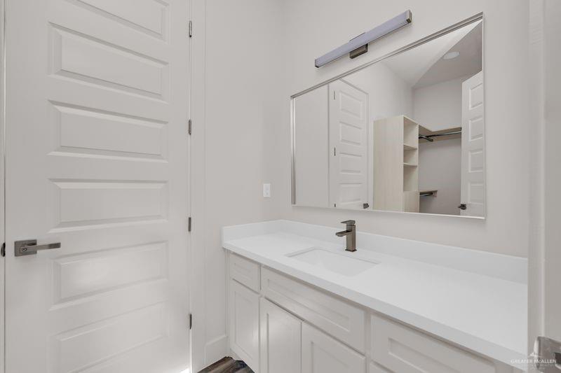 2305 Trinity Avenue McAllen, TX 78504 - Photo 14 of 24 a bathroom with a sink and a mirror view