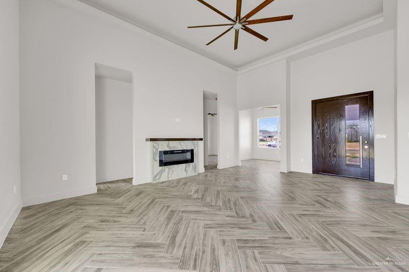 2305 Trinity Avenue McAllen, TX 78504 - Photo 5 of 24 a view of empty room with a fireplace