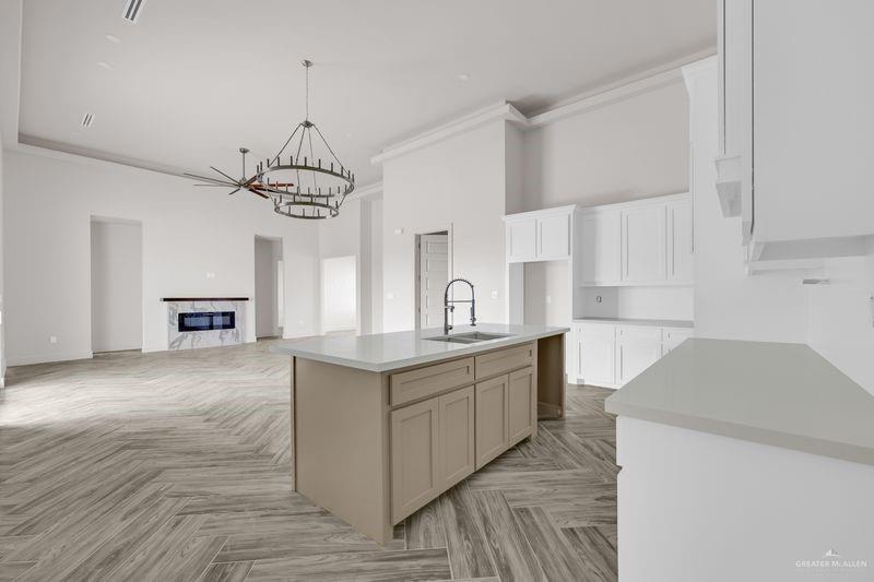 2305 Trinity Avenue McAllen, TX 78504 - Photo 8 of 24 a kitchen with a sink stove and cabinets