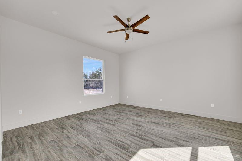 2305 Trinity Avenue McAllen, TX 78504 - Photo 9 of 24 a view of a big room with wooden floor and windows
