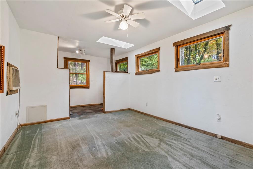 2123 Rocky Ridge Road Acme, PA 15610 - Photo 11 of 17 a view of an empty room with window and a ceiling fan