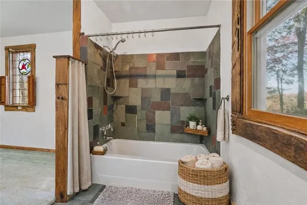 a bedroom with bed and cabinet