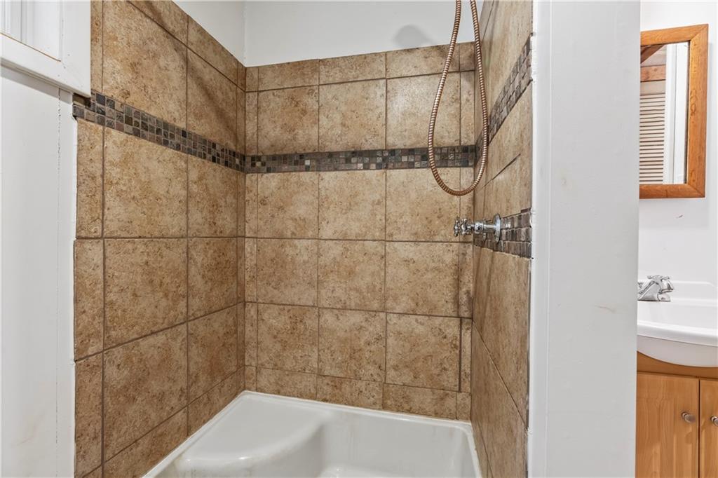 2123 Rocky Ridge Road Acme, PA 15610 - Photo 15 of 17 a bathroom with a shower and a bath tub