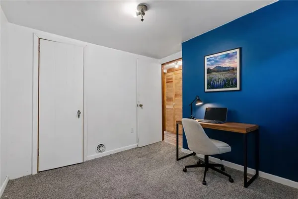 a wooden bench sitting in the middle of a yard