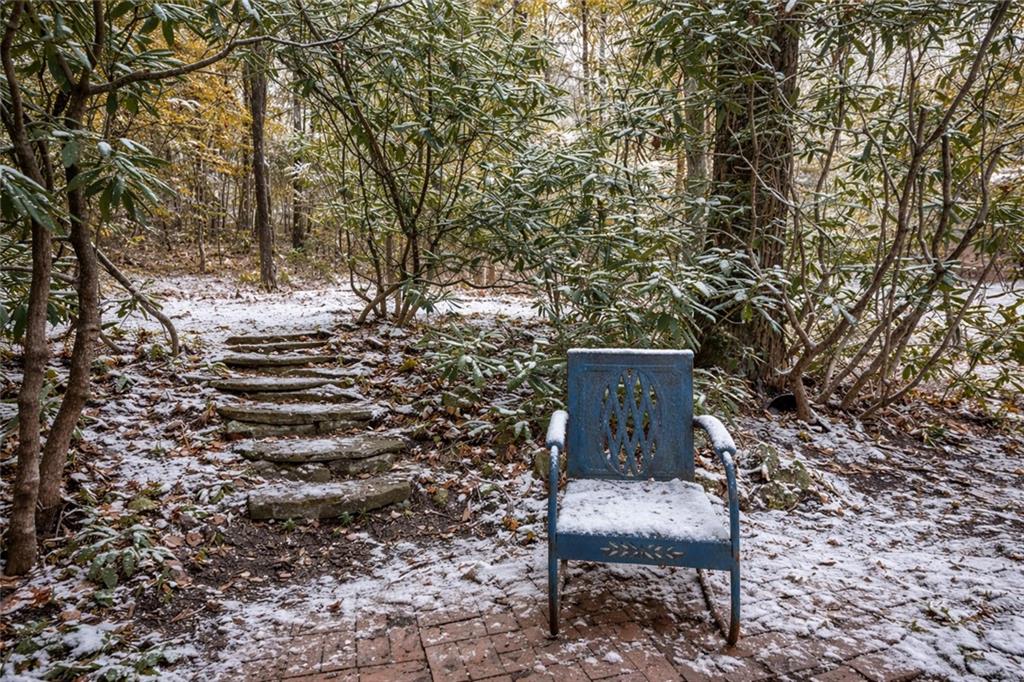 2123 Rocky Ridge Road Acme, PA 15610 - Photo 17 of 17 a wooden bench sitting in the middle of a yard