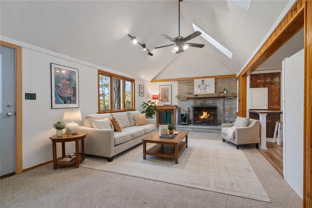 2123 Rocky Ridge Road Acme, PA 15610 - Photo 2 of 17 a living room with furniture a fireplace and a large window