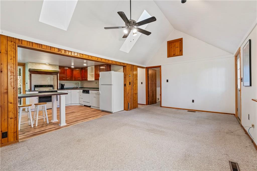 2123 Rocky Ridge Road Acme, PA 15610 - Photo 4 of 17 a view of a kitchen with a sink and a refrigerator