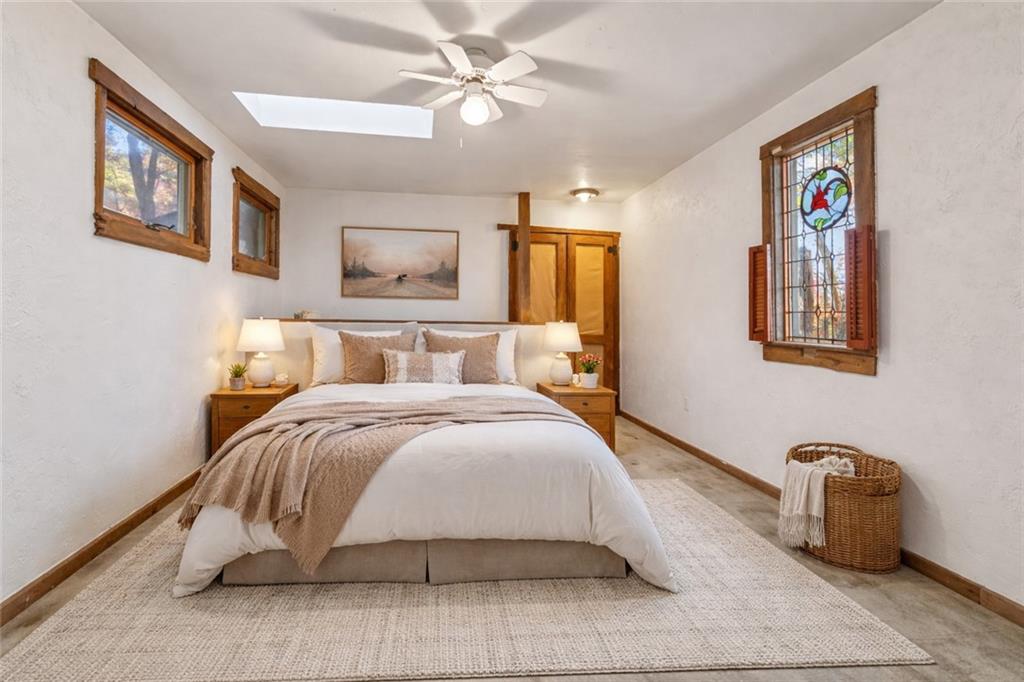 2123 Rocky Ridge Road Acme, PA 15610 - Photo 10 of 17 a bedroom with a bed and painting on the wall