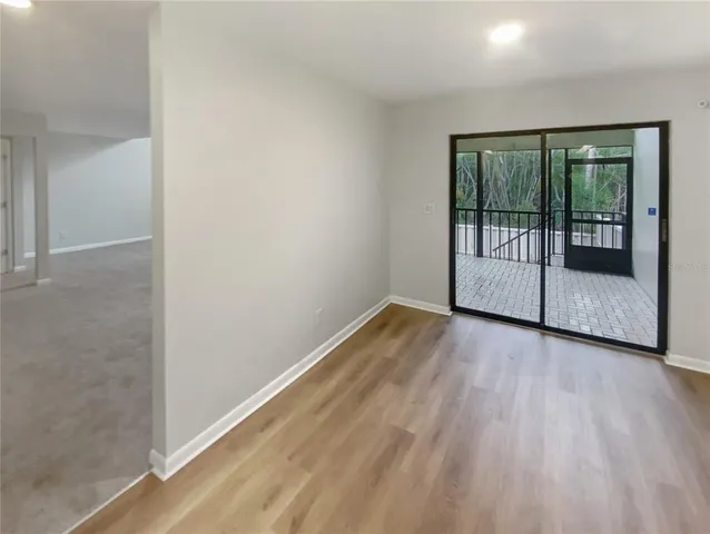 a spacious bathroom with a bathtub sink and mirror