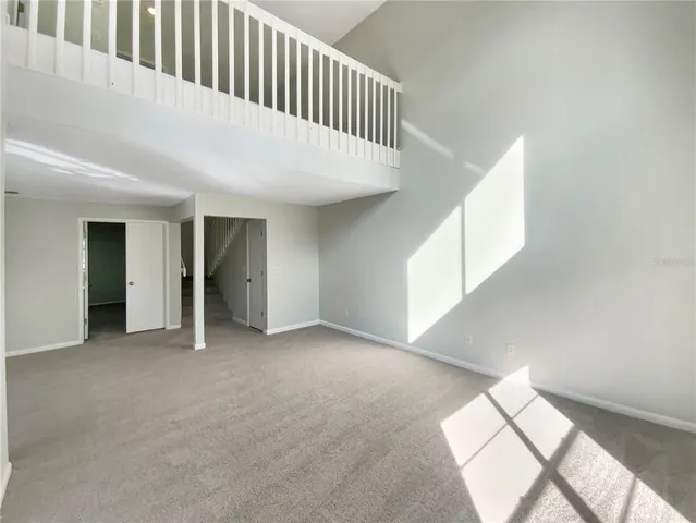 a view of a hallway with windows