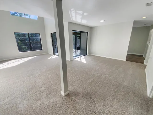 a view of an empty room and window