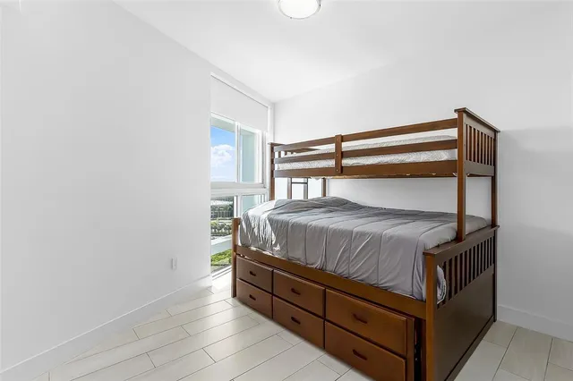 a bedroom with a bed and closet