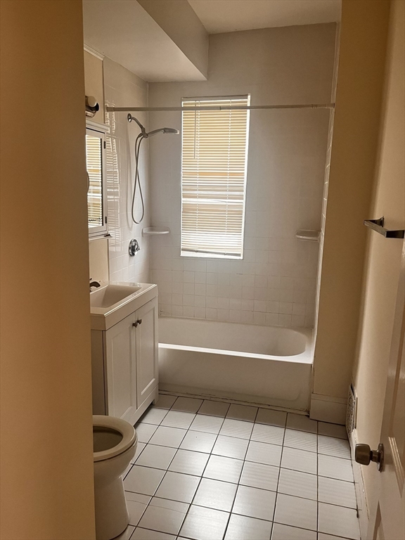 27 Irma Street, Unit 1 Boston, MA 02124 - Photo 5 of 8 a bathroom with a sink a toilet and a bathtub