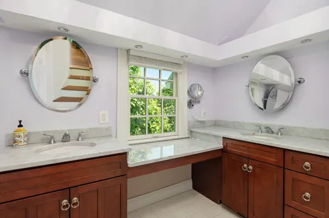a bathroom with a tub and sink
