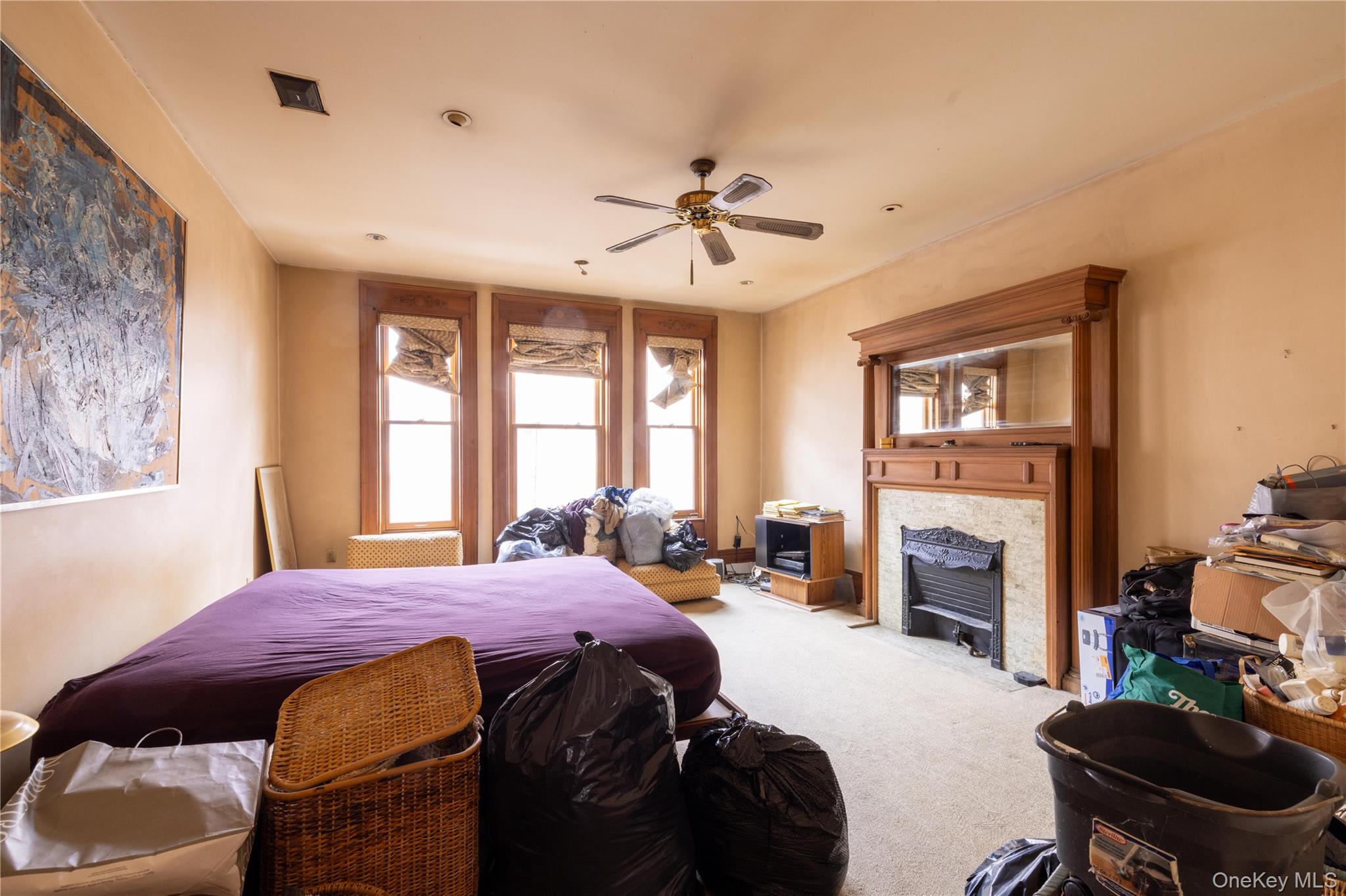 28 Hamilton Terrace Manhattan, NY 10031 - Photo 11 of 11 a spacious bedroom with a bed dresser and a chair