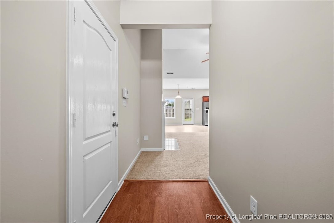 370 Roanoke Drive Raeford, NC 28376 - Photo 2 of 26 a view of a hallway with wooden floor