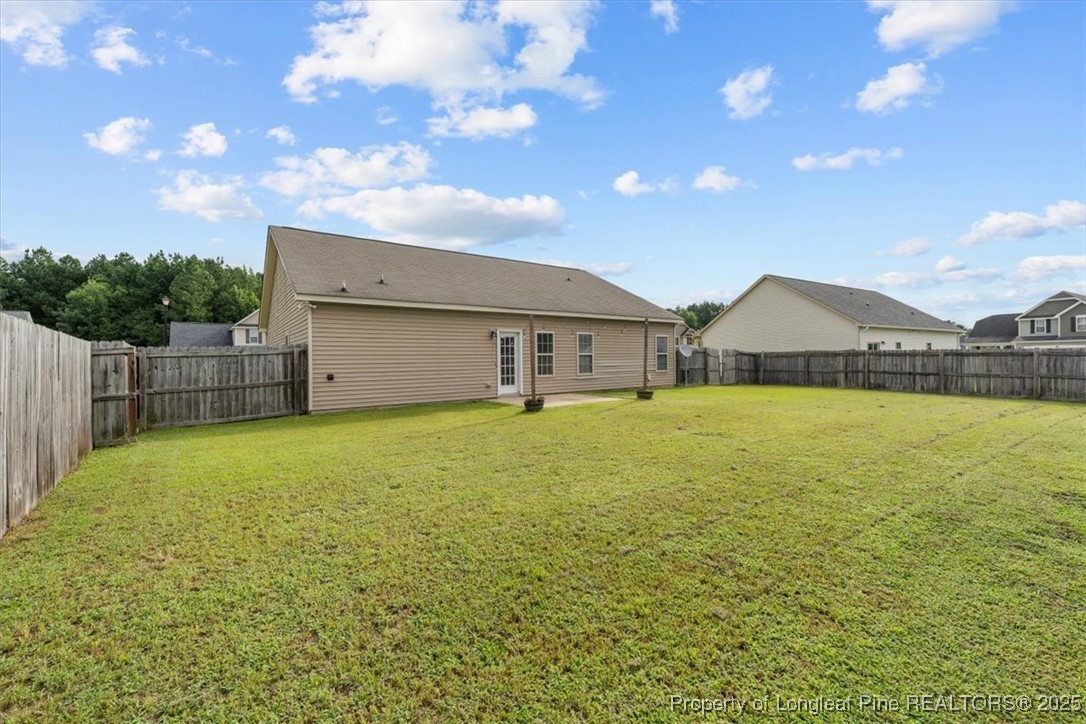 370 Roanoke Drive Raeford, NC 28376 - Photo 25 of 26 a front view of house with yard and garage