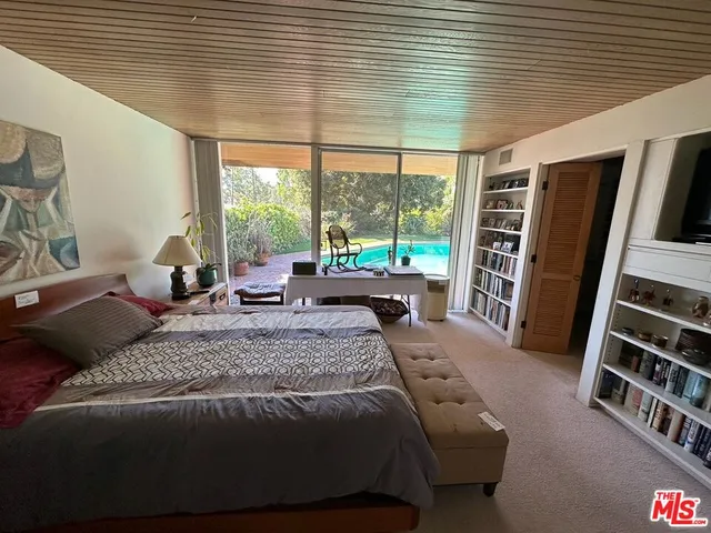 a bathroom with a tub shower and sink