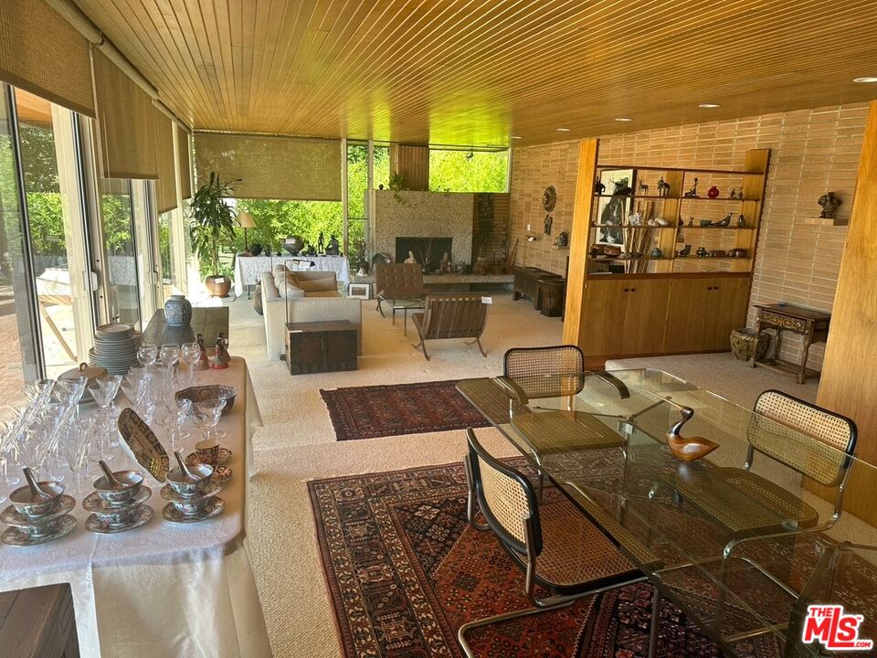 590 North Tigertail Road Los Angeles, CA 90049 - Photo 25 of 69 a living room with furniture