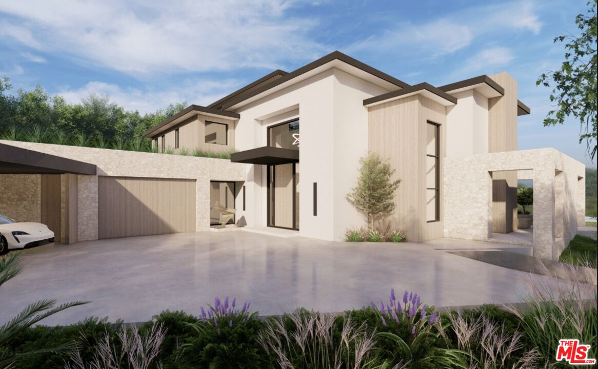 590 North Tigertail Road Los Angeles, CA 90049 - Photo 28 of 69 a front view of a house with a yard and garage