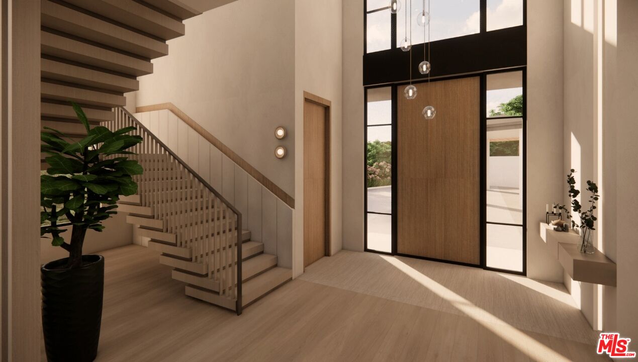 590 North Tigertail Road Los Angeles, CA 90049 - Photo 29 of 69 a view of entryway and hall with wooden floor