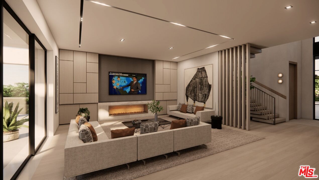 590 North Tigertail Road Los Angeles, CA 90049 - Photo 35 of 69 a living room with furniture and a flat screen tv