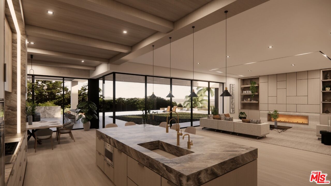 590 North Tigertail Road Los Angeles, CA 90049 - Photo 40 of 69 a kitchen with stainless steel appliances granite countertop a sink a stove and a wooden cabinets