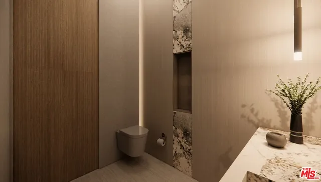 a bathroom with a sink and mirror