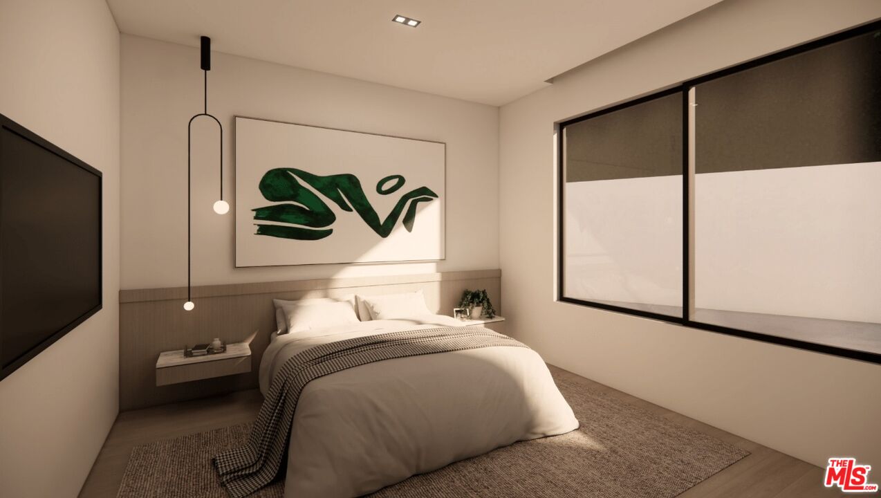 590 North Tigertail Road Los Angeles, CA 90049 - Photo 47 of 69 a bedroom with a bed and a flat screen tv